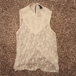 Sleveless cream colored blouse